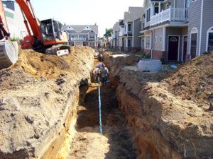 Єкскаваторник для прокладки водогону в Литві